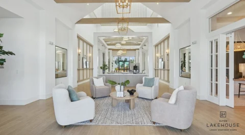Apartment lobby with seating area and high ceilings