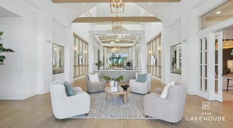 Apartment lobby with seating area and high ceilings